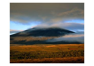 Clouds Over Volcano with Sunlit Plains in Foreground, Tongariro National Park, New Zealand Photographic Print by Dennis Johnson